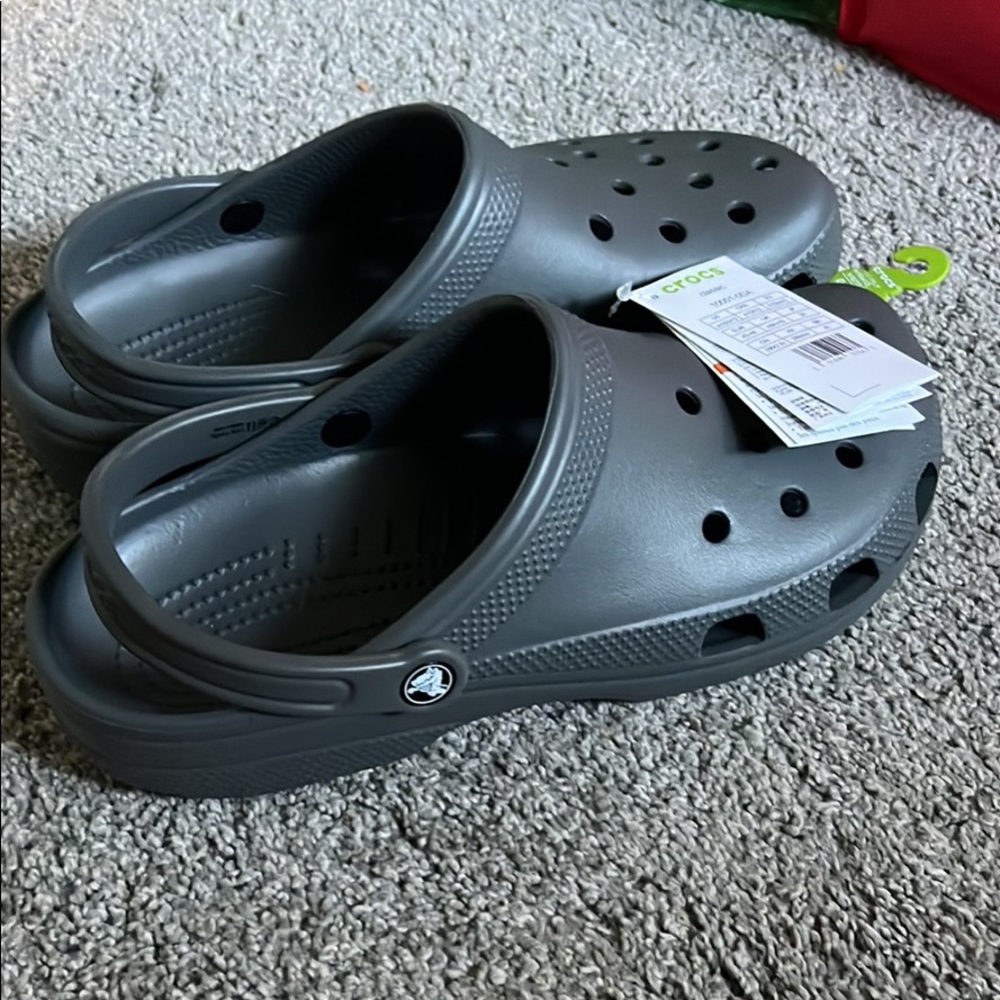 I have a pair of brand new Crocs! Size 12 womens size 10 mens!
